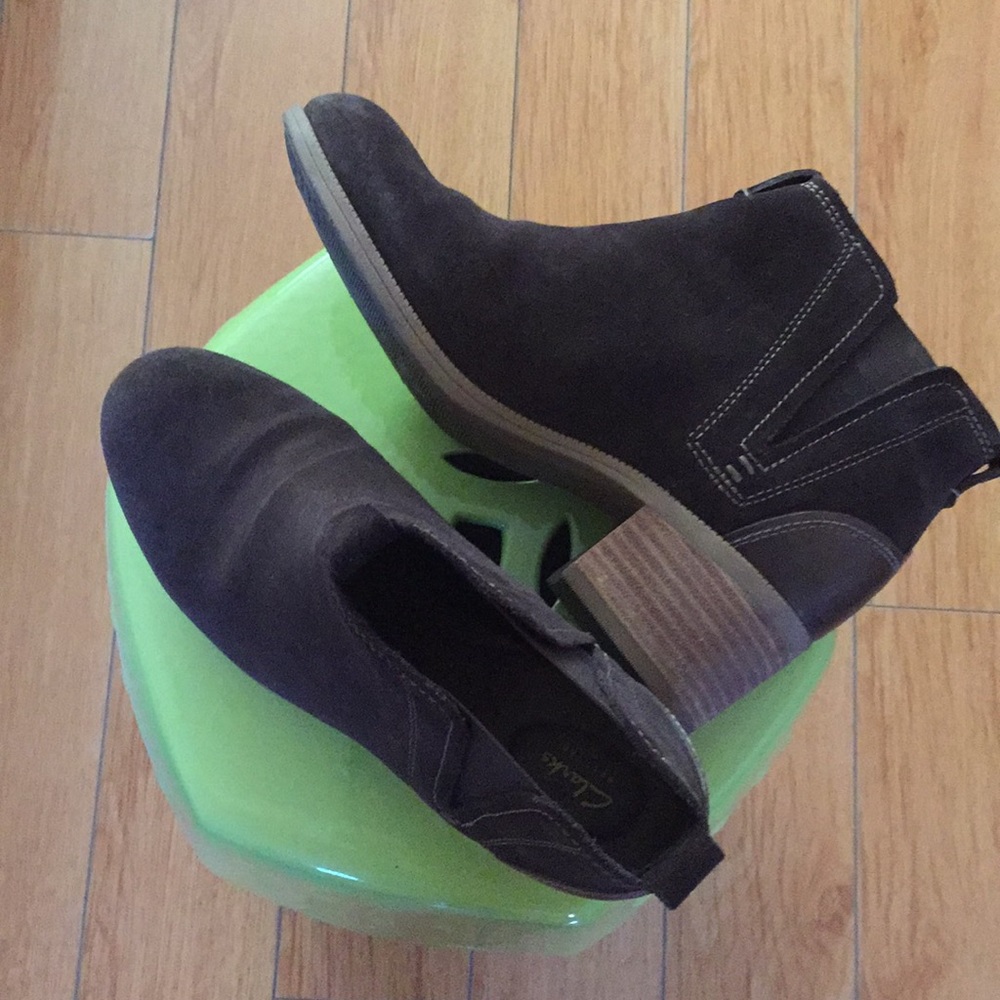 Clark’s dark brown boots .